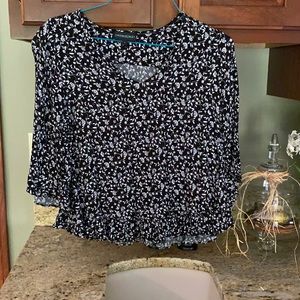 Black and white print top with ruffles. Size L